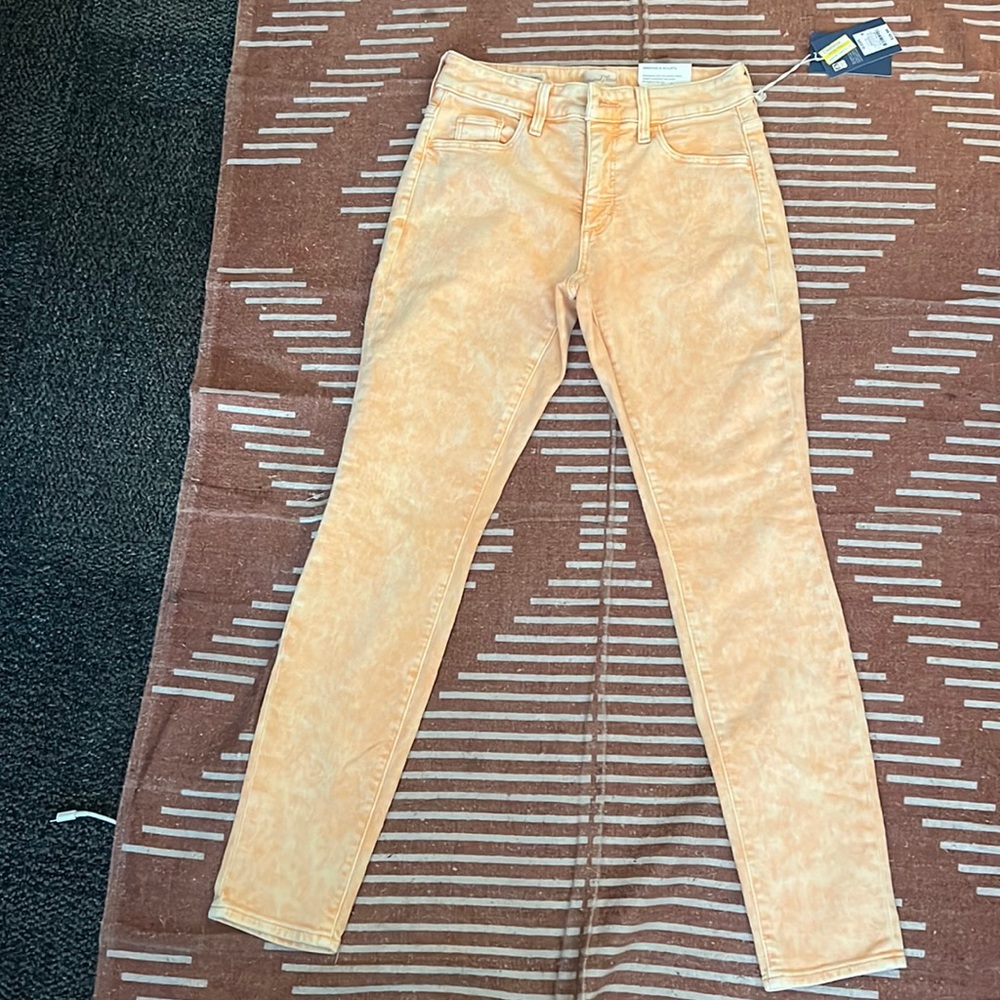 Never worn pastel orange jeans size 0 waist 25 regular